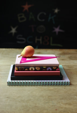 a back to school still life with books, roller and a pearの写真素材
