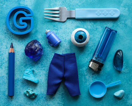 a blue background with a variety of toys and itemsの写真素材