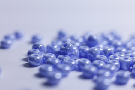 Blue beads on a white background.の写真素材