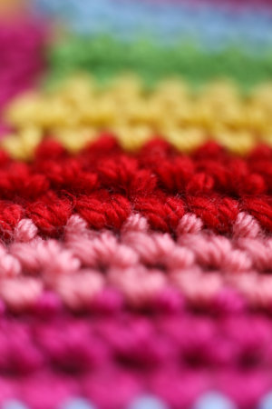 Macro shot of colorful crochet background. Selective focus.