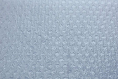 Close-up of a sheet of plastic wrap with bubbles. Abstract background.の写真素材