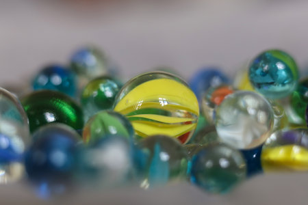 Colorful marbles close-up macro photography. Selective focus.