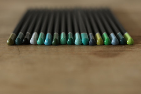 Colored pencils on wooden table, closeup. School suppliesの写真素材