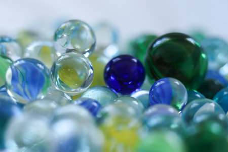 Colorful glass marbles on a white background. Selective focus.の写真素材