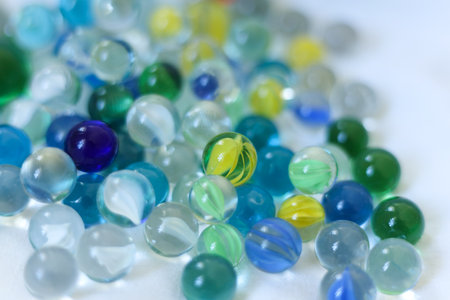 Colorful glass marbles on a white background. Selective focus.の写真素材