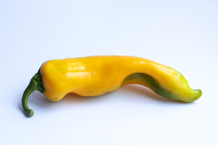 Yellow pepper on a white background. Vegetables for cooking.の写真素材