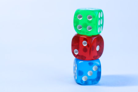 Colorful dices on a white background, closeup of photoの写真素材