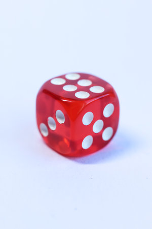 Red dice on a white background. Close-up. Isolated