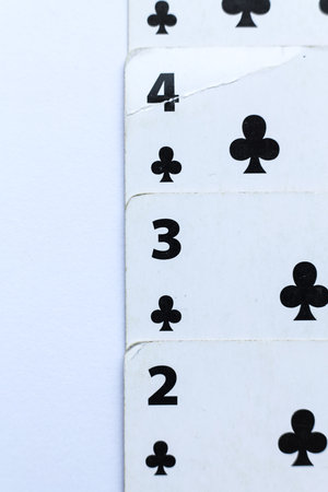 Playing cards on a white background, close-up, selective focus