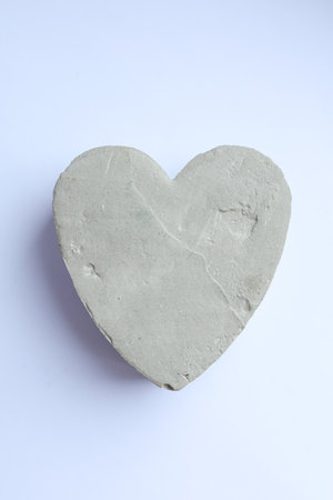 concrete heart on a white background. Valentine's Day. Love.