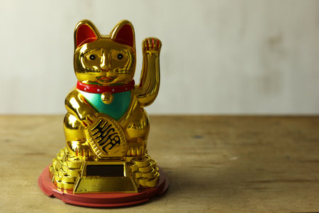 chinese gold maneki neko cat, symbol of luckの写真素材