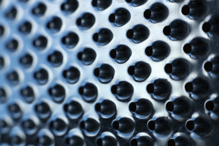 close-up of a metal grater textured backgroundの写真素材