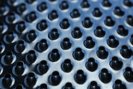 close-up of a metal grater textured backgroundの写真素材