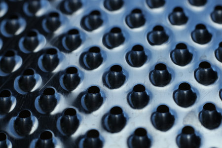 close-up of a metal grater textured backgroundの写真素材