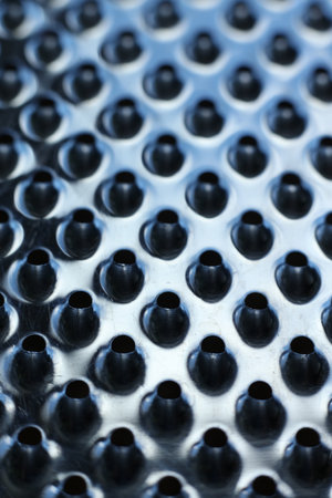 close-up of a metal grater textured backgroundの写真素材