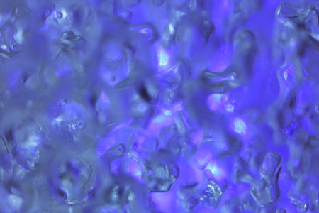 hydrogel balls in blue light abstract background, close up.の写真素材