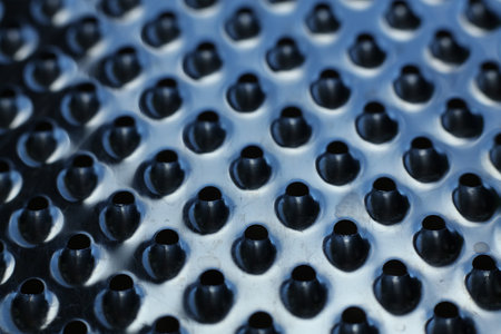 close-up of a metal grater textured backgroundの写真素材