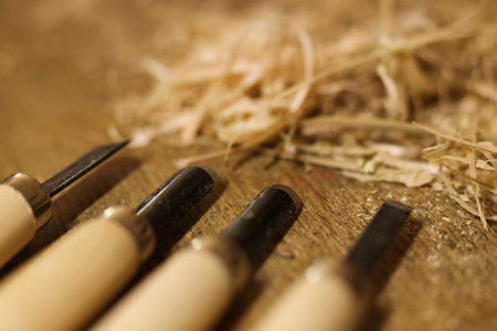 Woodworking tools on a wooden table with sawdust. Close-up.の写真素材