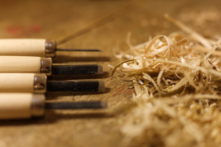 Woodworking tools on a wooden table with sawdust. Close-up.の写真素材