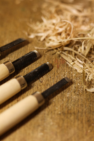 Woodworking tools on a wooden table with sawdust. Close-up.の写真素材