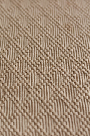 Close-up of beige fabric texture background. Macro shot.の写真素材