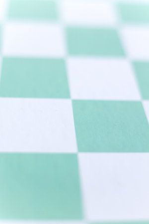 Green and white checkerboard background. Shallow depth of field.の写真素材