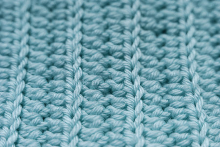 Blue crochet fabric as a background. Close-up. Macro