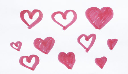 Hand-drawn hearts on a white background. Drawing by markers.