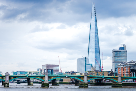 The Shard in the London view with Southwark Bridge over River Thamesのeditorial素材