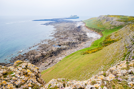 Rocky Sea Shore View On A Cloudy Day In Rhossili, Wales Coast Pathの写真素材