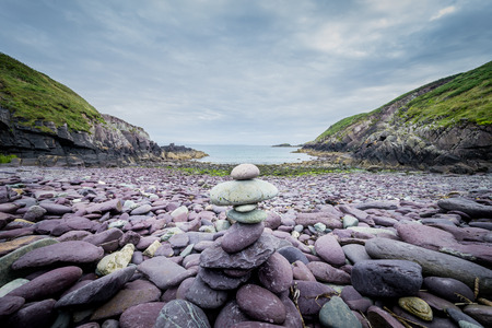 Pebbles stack on the beach on Caer Bwdy Bay in St.Davids, Walesの写真素材