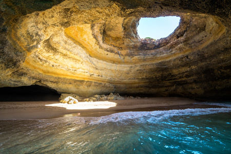 Inside view of the Benagil Sea Cave on Praia de Benagil, Benagil Beach Algarve Portugal.の写真素材