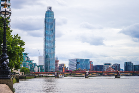 The Vauxhall Tower in the London view with Vauxhall Bridge over River Thamesの写真素材