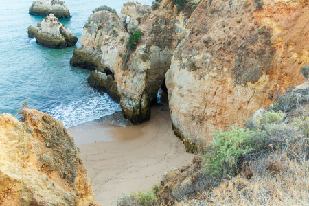Tiny remote beach in Lagos, Algarve, Portugal. A hidden secret beach between limestone walls.の写真素材