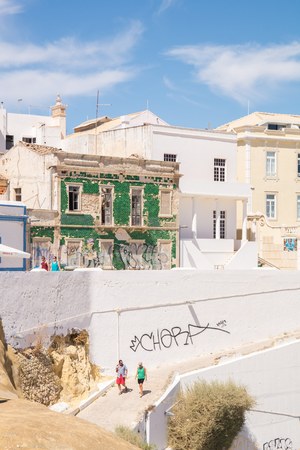 Traditional green tile covered old house on the streets of Albufeira, Algarve, Portugal.のeditorial素材