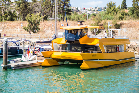 Yellow dolphin watching coastline cruise catamaran tied in the bay of Marina de Albufeira, Albufeira Algarve, Portugal.のeditorial素材