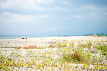 Partly cloudy day on the sandy beach in Paralia Katerini, Aegean Sea, Greece.の写真素材