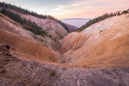 Sunset view at the Ruginoasa Hole or Groapa Ruginoasa in the south close to the Dry Valley in Apuseni Natural Park, Romania.の写真素材
