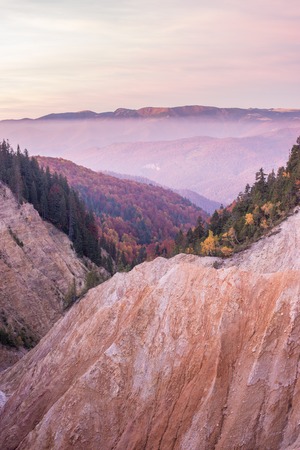 Sunset view at the Ruginoasa Hole or Groapa Ruginoasa in the south close to the Dry Valley in Apuseni Natural Park, Romania.の写真素材