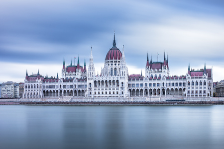 Front view to the Hungarian Parliament on a cloudy day in Budapest, Hungary.のeditorial素材