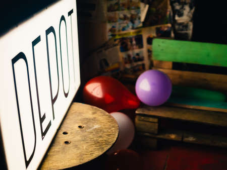 Cardiff, Wales - April 8, 2017: Abandoned lightbox sign of Depot pub in Cardiff sitting on a table, blurry background - UK.のeditorial素材