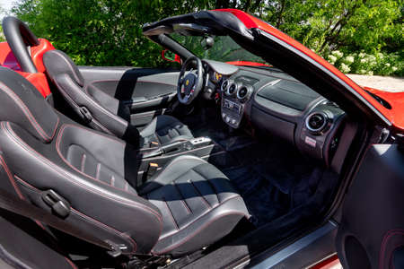 BUDAPEST, HUNGARY - May 11, 2021: Ferrari F430 - Spider, Italian sports car interior designed by Pininfarina, photographed by GellÃ©rt Hill lookout point, with the panorama of Budapest.のeditorial素材