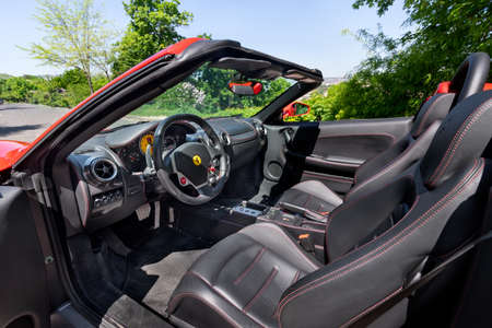 BUDAPEST, HUNGARY - May 11, 2021: Ferrari F430 - Spider, Italian sports car interior designed by Pininfarina, photographed by GellÃ©rt Hill lookout point, with the panorama of Budapest.のeditorial素材