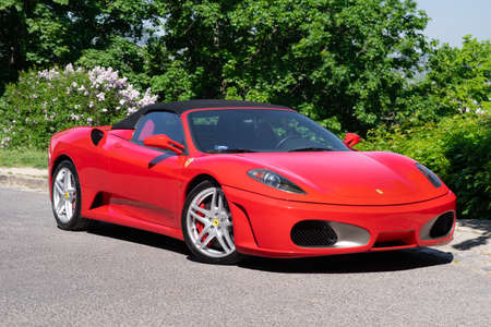 BUDAPEST, HUNGARY - May 11, 2021: Ferrari F430 - Spider, Italian sports car interior designed by Pininfarina, photographed by GellÃ©rt Hill lookout point, with the panorama of Budapest.のeditorial素材