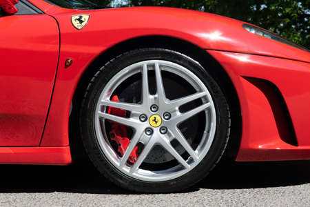 BUDAPEST, HUNGARY - May 11, 2021: Ferrari F430 - Spider, Italian sports car interior designed by Pininfarina, photographed by GellÃ©rt Hill lookout point, with the panorama of Budapest.のeditorial素材