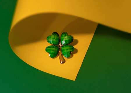 Green clover leaf on yellow and green background. St. Patrick's Day concept.の写真素材
