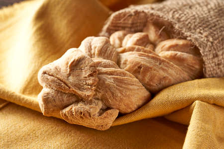 braided homemade bread on tablecloth
