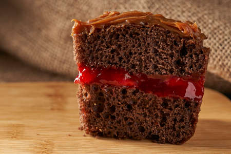 slide of chocolate cake with dulce de leche caramel and strawberry jelly