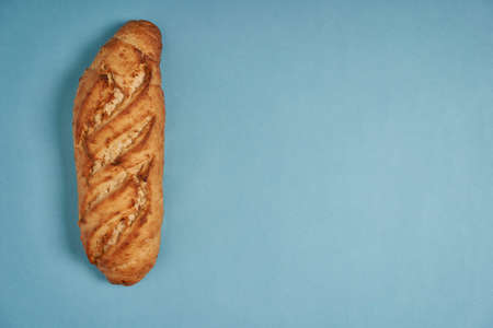top view large cheese and onion flavored bread light blue backgroundの写真素材