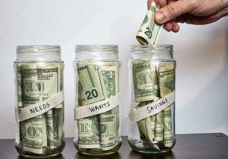 personal finance 50 30 20 system needs wants savings. Man saving